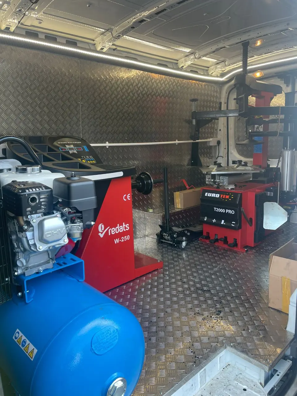 Redats W-250 wheel balancer and Eurotek T2000 Pro tyre changer inside Lux Tyres van