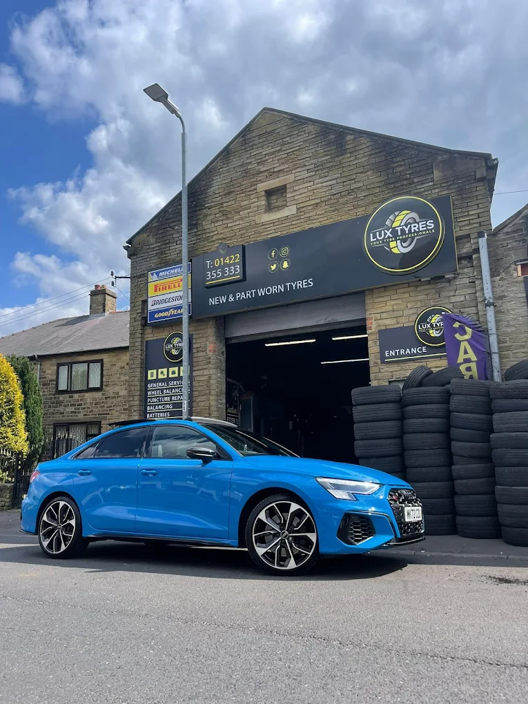 Blue Audi A3 outside Lux Tyres Halifax