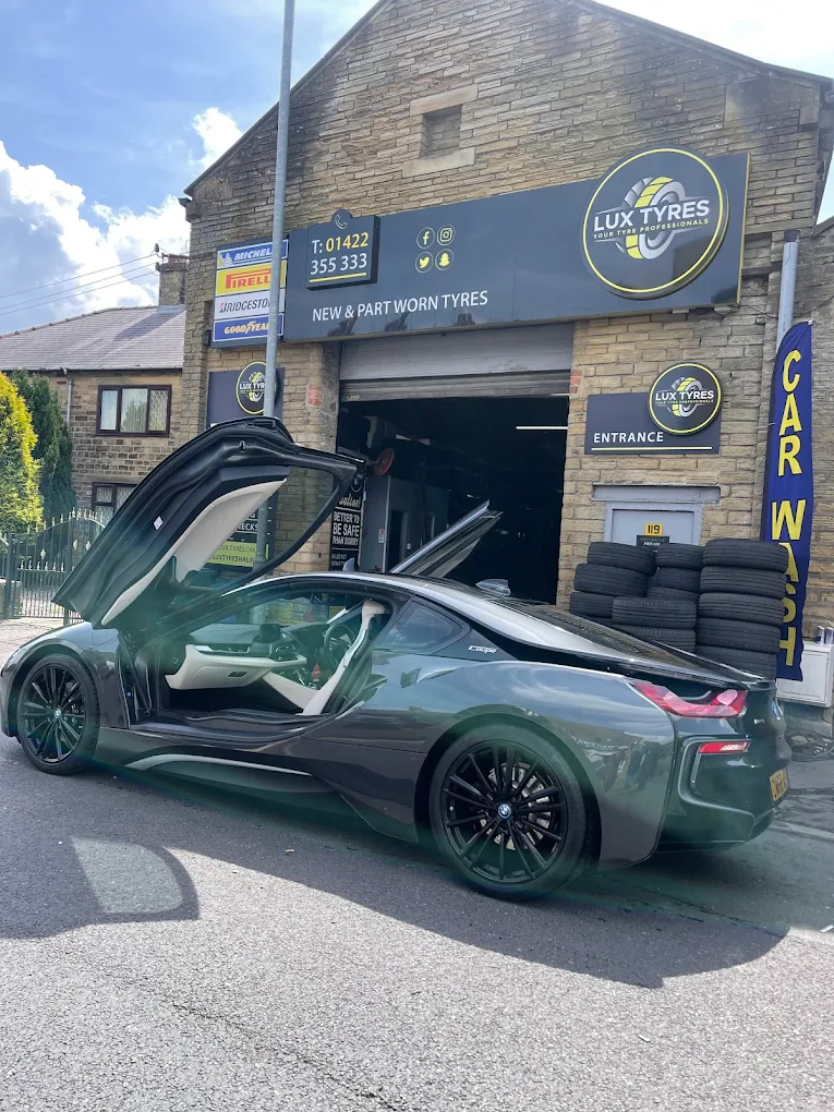 BMW i8 with gull-wing doors at Lux Tyres