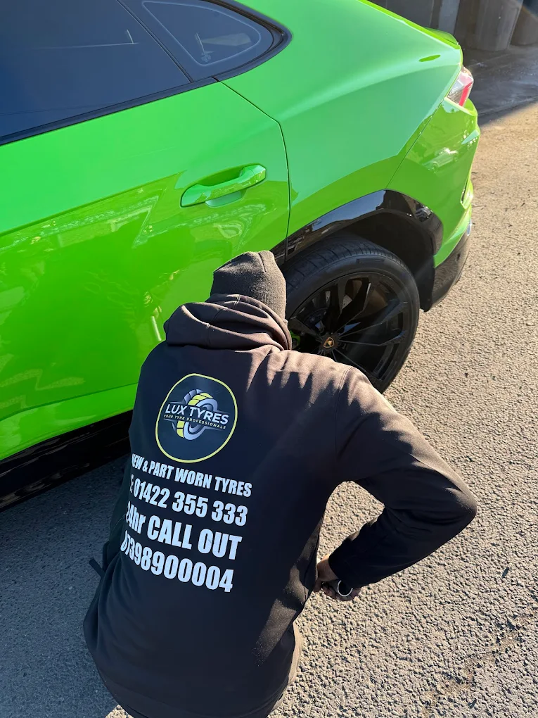 Lux Tyres tyre technician fitting a tyre - serving Halifax